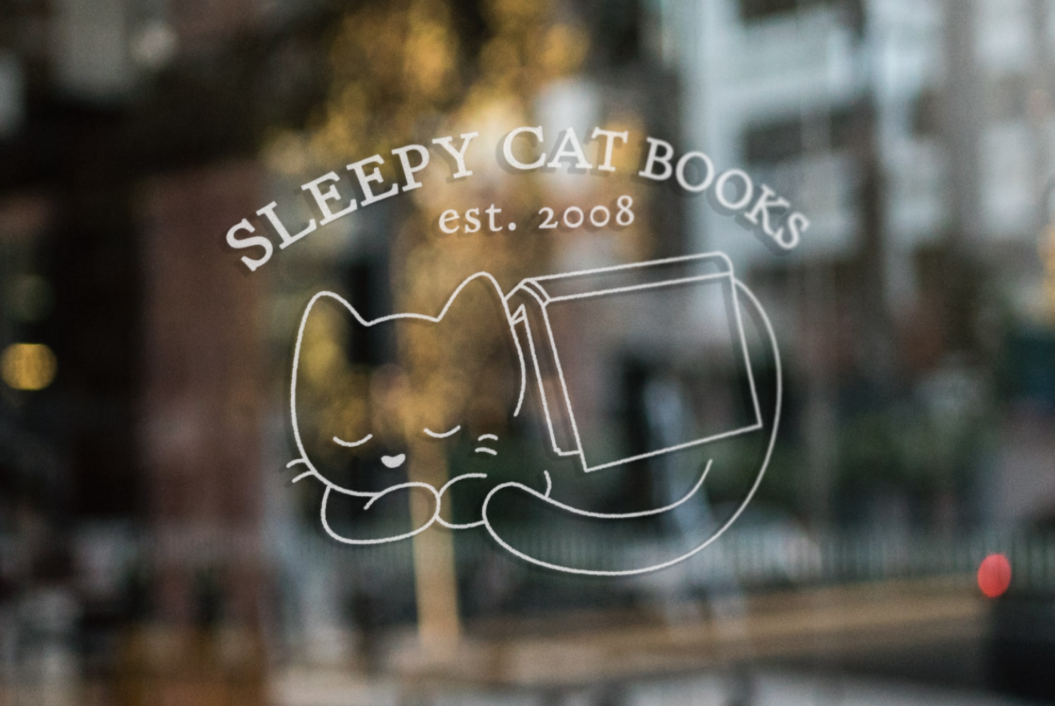 Mockup of the logo in white on a store window